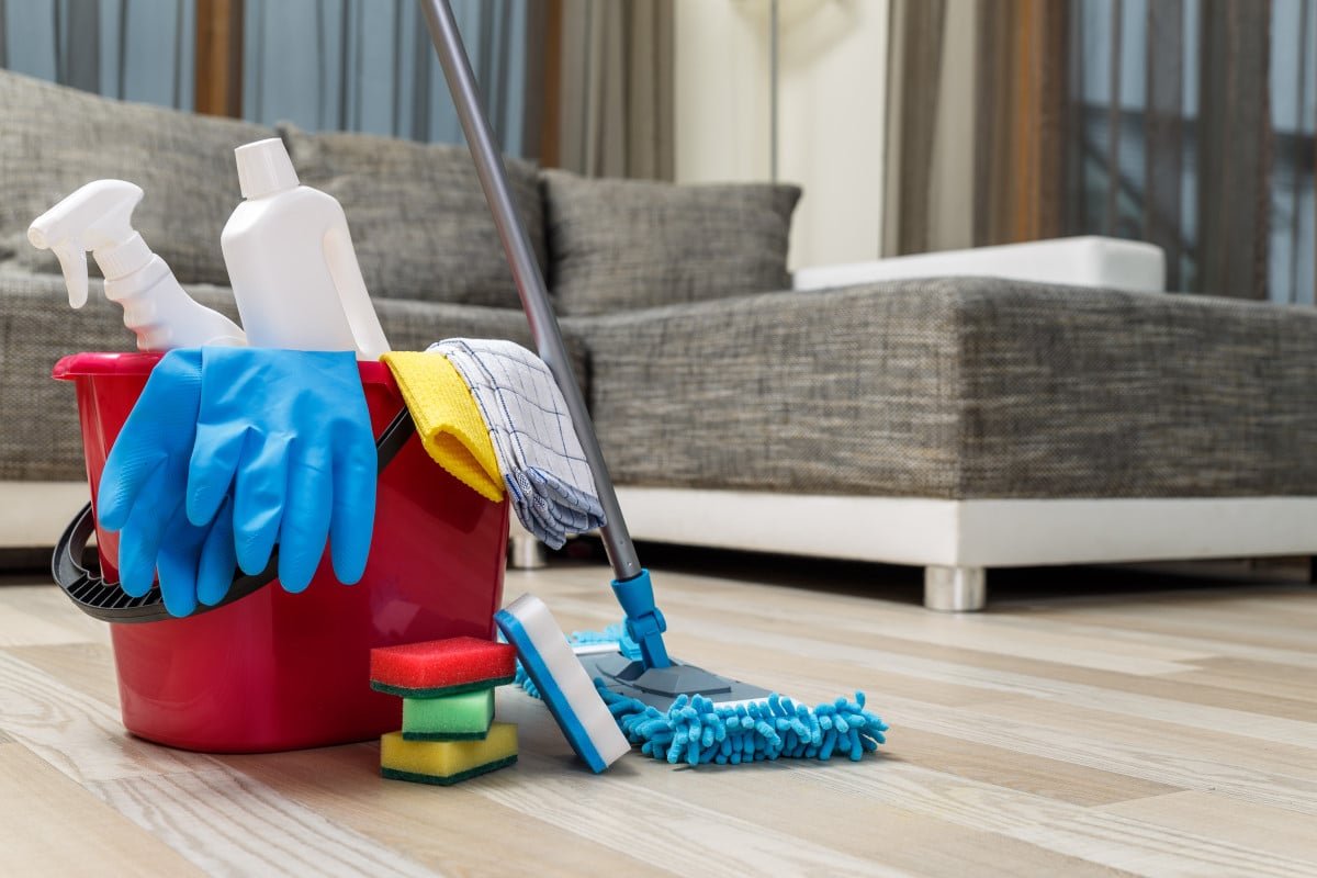 Cleaning supplies ready in a bright living room